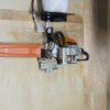 chainsaw bracket and holder for enclosed trailer