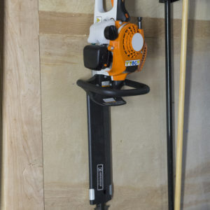 hedge trimmer holder for enclosed trailer