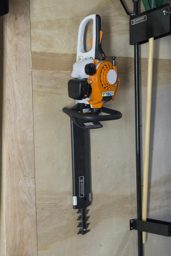 hedge trimmer holder for enclosed trailer